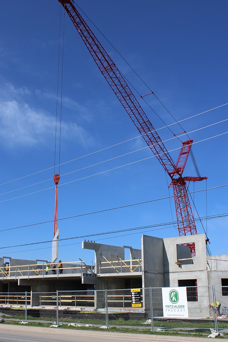 Building site with precast concrete calls and crane